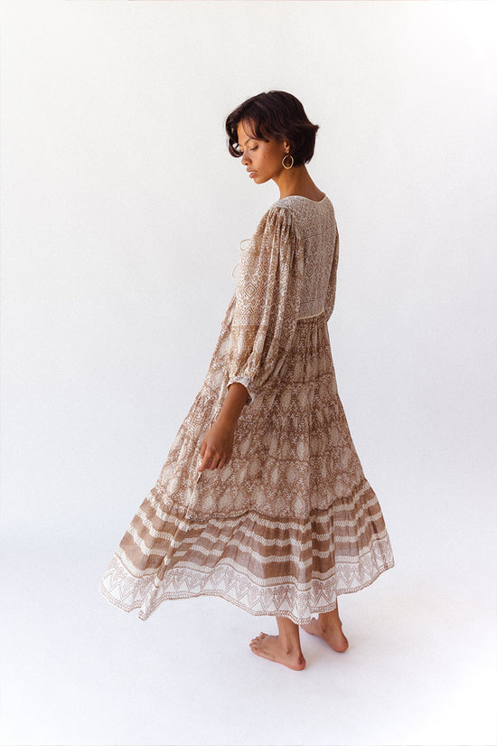 Daughters of India Jasmine Midi Dress in Shell — studio side profile in motion, flowing tiered skirt and balloon sleeves
