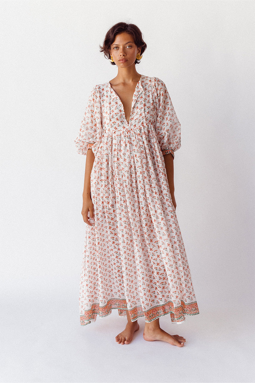 Daughters of India Kyra Maxi Dress in Coral — studio full length front, V-neckline with billowed sleeves, border hem