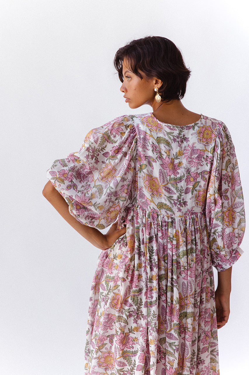 Daughters of India Kyra Midi Dress in Fuchsia Bloom — studio back view, billowed sleeves, gathered waist detail