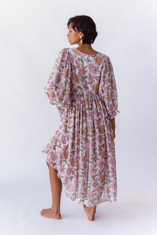 Daughters of India Kyra Midi Dress in Fuchsia Bloom — studio back view walking, billowed sleeves, flowing skirt
