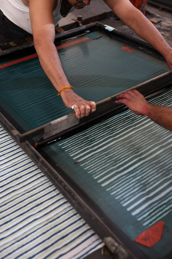 Ria Blouse Cyan Candy — artisan block printing process, wooden hand-carved block on cyan stripe cotton fabric, traditional Sanganer Jaipur block printing craft India | Daughters of India