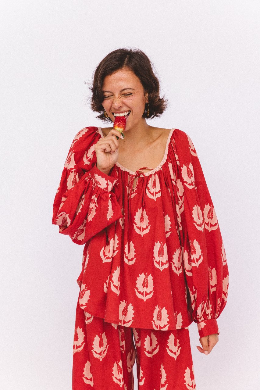 Ria Blouse Ruby Red — studio full length front view, model wearing ruby red hand block print cotton blouse with botanical leaf motif, relaxed fit with tie details, artisan Jaipur India | Daughters of India