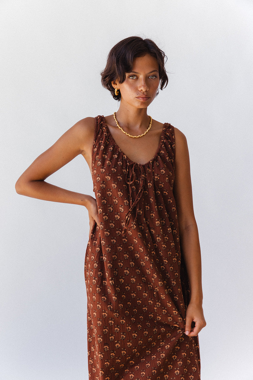 Sundress Midi Almond — ghost flat lay product shot, full dress displayed flat showing silhouette, almond floral block print cotton midi dress, sleeveless sundress | Daughters of India artisan India