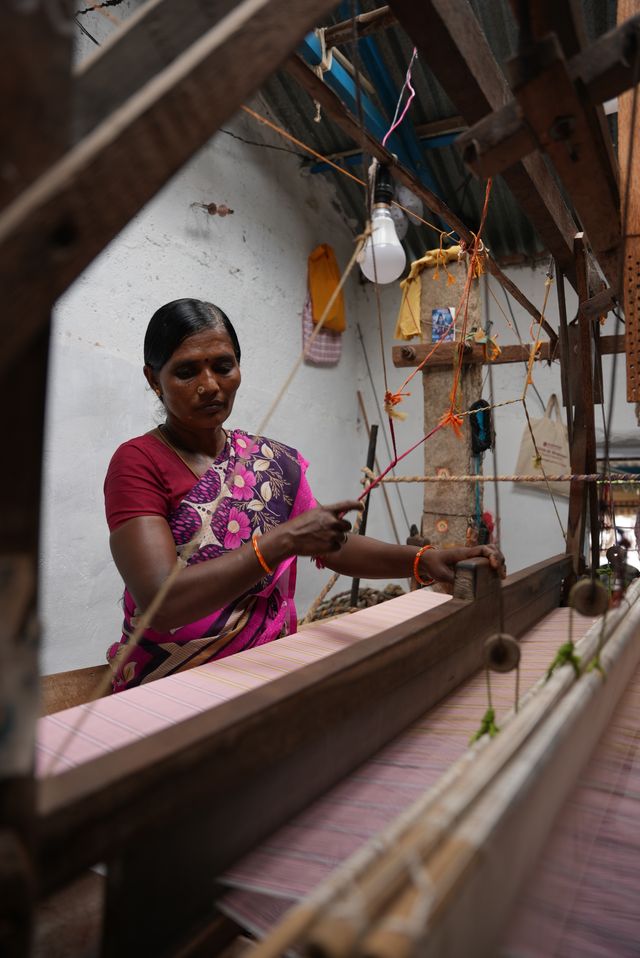 Indian handloom weaver working at traditional wooden loom - Daughters of India artisan craft process